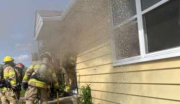Firefighters battle a house fire on Oxford Street East at Highbury Avenue, May 16, 2024. Photo provided by the London Fire Department.