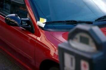 A parking ticket on the windshield of a vehicle. File photo courtesy of © Can Stock Photo / waynerd