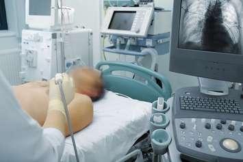 An ultrasound is used to scan a patient's lungs. File photo courtesy of © Can Stock Photo / zandb1.