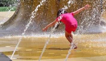 Child playing in spray pad. File photo courtesy of© Can Stock Photo / lucidwaters
