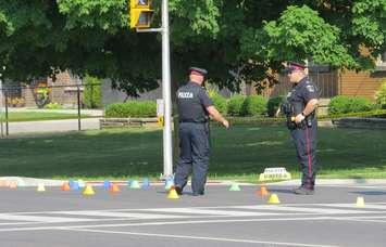 The SIU and police investigate after an OPP cruiser collided with 
a cab on Southdale Road at Verulam Street, July 29, 2019. (Photo by Miranda Chant, Blackburn News.)