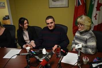 Windsor West MPP Lisa Gretzky, left, comforts Noah Helou, 21, as Noahs mother Michelle describes how funding for his care was cut off at his 18th birthday, during a media event at Gretzkys constituency office in Windsor, December 7, 2018. Photo by Mark Brown/Blackburn News.