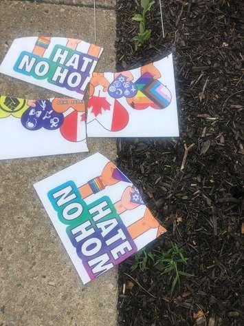 Anti-hate sign torn to pieces (Image courtesy of Kelly Spencer via Facebook)