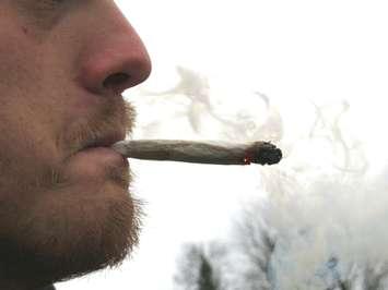 Man smoking a joint. (File photo by Miranda Chant, Blackburn News)