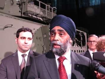 Canadian Defence Minister Harjit Sajjan and London North Centre MP Peter Fragiskatos speak to reporters at General Dynamics Land Systems in London, February 10, 2017. (Photo by Miranda Chant, Blackburn News.)