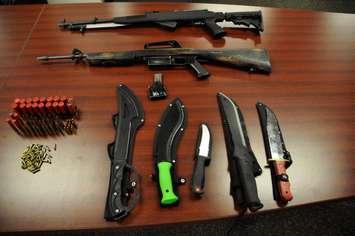 Guns, ammunition, and knives seized by police at a home on Grammercy Park Place in London. Photo provided by London police. 