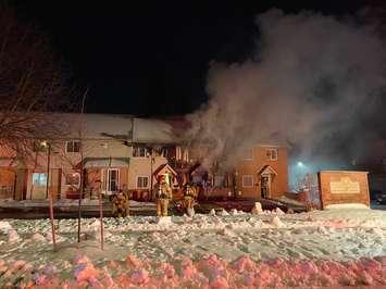 Firefighters battle a blaze at a townhouse on Kimberley Avenue in London, January 21, 2020. (Photo courtesy of the London Fire Department via Twitter)