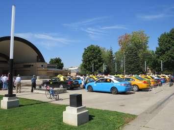 Dozens of taxis fill the area in front of the bandshell at Victoria Park for a rally against Uber. September 16, 2015. Photo by Scott Kitching, Blackburn News.