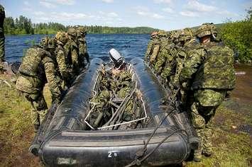 Soldiers deploy an inflatable boat. File photo courtesy of Canadian Armed Forces/DND 2020