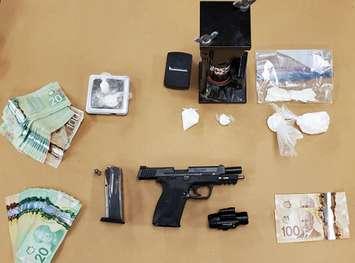 A loaded handgun and drugs seized during a raid in east London, February 18, 2021. Photo courtesy of London police.