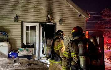 Fire crews on scene of a house fire on Riverside Drive west of Wharncliffe Road, January 26, 2022. Photo courtesy of the London Fire Department. 