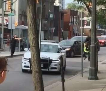 A video posted to Reddit by user u/cainboi shows a London police officer firing two shots on an armed suspect in the downtown, September 3, 2019. 