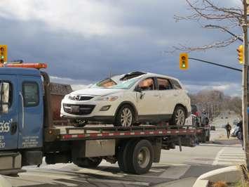 An SUV is towed away after a crash that sent it onto its side at York St. and Ridout St. in London, December 2, 2016. (Photo by Miranda Chant, Blackburn News.)