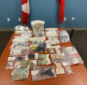 Drugs, a firearm, and cash seized as part of a drug trafficking investigation in London, May 31, 2022. Photo courtesy of the RCMP.