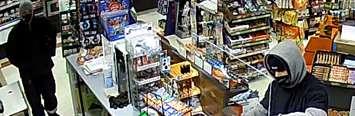 Two suspects wanted in connection with a variety store robbery at 265 Oxford Street East, April 27, 2021. Image courtesy of London police.  