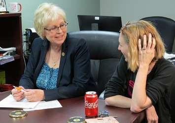 London West MPP Peggy Sattler speaks with Sarah Farrants a mother of a 3 -year-old boy with autism, May 27, 2019. (Photo by Miranda Chant, Blacknburn News)