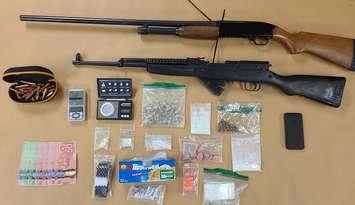 Fentanyl, two guns and various other items seized by police in the raid of an Exeter Road home, November 18, 2021. Photo courtesy of London police. 