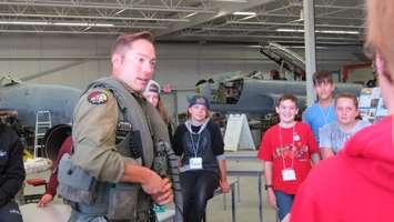 CF-18 pilot Captain Ryan Kean speaks to Grade 7 students from Lord Nelson PS at the Jet Aircraft Museum, September 15, 2016. (Photo by Miranda Chant, Blackburn News.)
