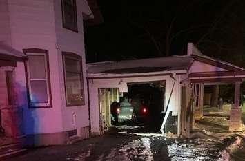 A pickup truck crashed into a vacant house after hitting two hydro poles on Denfield Road, January 23, 2021. Photo courtesy of Middlesex OPP.
