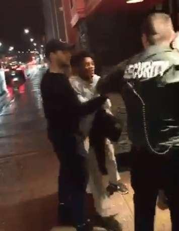 Police are investigating an altercation that ended with one man being punched in the face outside of Molly Blooms Irish Pub, April 16, 2018. (Video still courtesy of Aaron King)