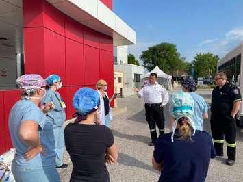 A group of Erie Shores Healthcare employees and Essex-Windsor EMS paramedics gather for a briefing before testing agri-food workers for COVID-19, June 2, 2020. Photo submitted by Kristin Kennedy/ESHC.