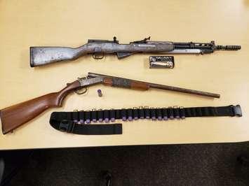 London police recover two firearms and ammunition after conducting a search warrant in relation to a New Year's Day drive-by shooting. (Photo via londonpolice.ca)