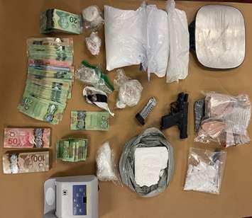 Drugs, a handgun, and other items seized during a raid on three London homes, September 28, 2021. Photo courtesy of London police. 