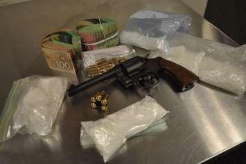 Drugs, gun, ammunition, and cash seized during a raid in east London, November 23, 2015. (Photo courtesy of London police.)