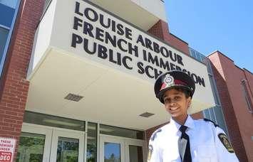 11-year-old Chinmayi Manda, London's police chief of the day, standing outside of Louise Arbour French Immersion, May 15, 2017. (Photo by Miranda Chant, Blackburn News.)