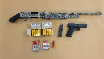 A shotgun, replica handgun and shells seized by London police, May 11, 2022. Photo courtesy of London police.