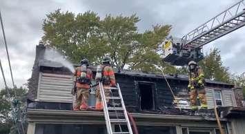 London firefighters putting out host spots at home on Regent Street that caught on fire. September 15, 2021. (Image captured from footage via @LdnOntFire on Twitter)