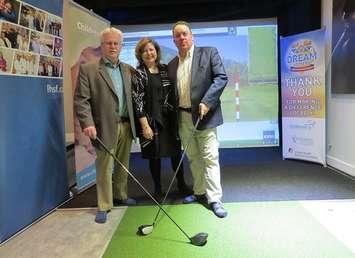 Chair of London Health Sciences Foundation Ron Mikula, President and CEO of St. Joseph’s Health Care Foundation Michelle Campbell, and President and CEO, Children’s Health Foundation Scott Fortnum stand in the golf simulator at the Dream Home at 2162 Ironwood Rd., April 18, 2019. (Photo by Miranda Chant, Blackburn News)