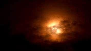 Generic photo of solar eclipse with light cloud cover. (Photo by © Can Stock Photo / sjhuls)