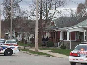London police surround a home on Madison Ave. Photo by Ashton Patis.