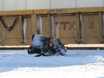 The wreckage at a fatal collision involving a sidewalk plow and a freight train, Jan 9, 2018. (Photo by Miranda Chant, Blackburn News) 