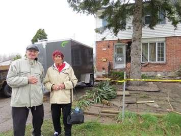 Joseph and Pauline Morello stand in front of their damaged Culver Dr. home. A vehicle crashed into the home early April 19, 2017. (Photo by Miranda Chant, Blackburn News.)