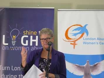 Megan Walker, executive director of the London Abused Women's Centre, speaks to reporters on Friday, October 17, 2014