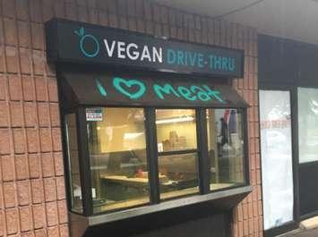 Vandals spray painted mean-spirited message on Globally Local's drive-thru, June 22, 2017. Photo courtesy of Globally Local.