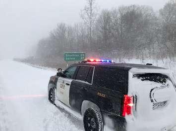 A OPP vehicle parked on the shoulder of Hwy. 402 near Longwoods Rd.  (Photo courtesy of the OPP)