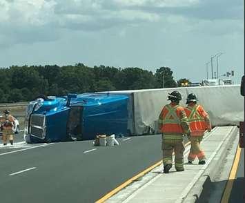 An overturned transport truck blocks Veterans Memorial Parkway on July 11, 2018. Photo courtesy of London police. 