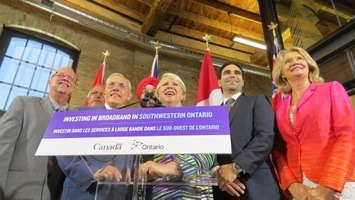 Western Ontario Wardens' Caucus members Gerry Marshall and Randy Hope, Ontario Infrastructure Minister Bob Chiarelli, Federal Minister of Innovation, Science, and Economic Development Navdeep Bains, MPP Deb Matthews, MP Peter Fragiskatos, and MP Kate Young at the London Roundhouse, July 26, 2016. (Photo by Miranda Chant, Blackburn News.)