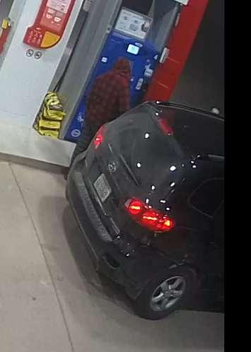 A photo of a suspect and a Hyundai SUV, both sought by Woodstock Police. April 24 2021. (Photo courtesy of Woodstock Police).