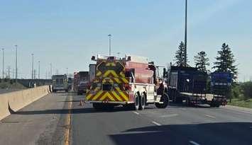 Emergency crews on scene of a two-vehicle crash on Highway 401 near Wellington Road, May 7, 2024. Photo provided by Middlesex OPP