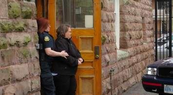 Elizabeth Wettlaufer is escorted out of the Woodstock courthouse, April 21, 2017. (Photo by Miranda Chant, Blackburn News)