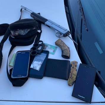 A sawed-off rifle, brass knuckles and drugs seized during an arrest downtown, January 7, 2021. Photo courtesy of London police. 