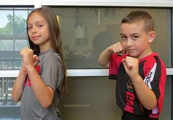 Athena Papadatos and Kaleb Boyle show off their karate moves. The two 8-year-olds from London are training for the World Karate Championships in Dublin, Ireland at the end of October. (Photo by Miranda Chant, Blackburn News)