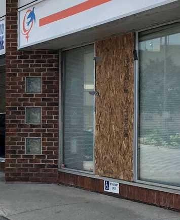 The front window of the London Abused Women's Centre is boarded up after being smashed by a vandal over the weekend. Photo submitted. 