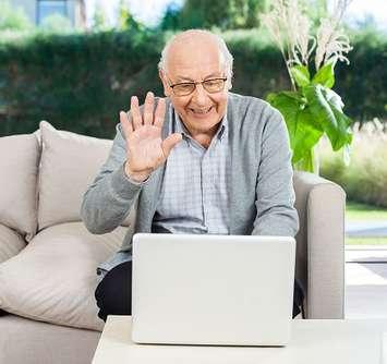 A senior on a video chat on his laptop. File photo courtesy of © Can Stock Photo / Leaf