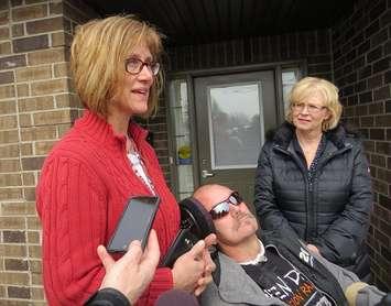 Tanya Dallaire speaks about her brother Shawn Eyre's physical disability while London West MPP Peggy Sattler looks on at a news conference outside of Participation House in London, March 24, 2017. (Photo by Miranda Chant, Blackburn News.) 