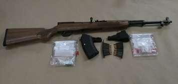 A semi-automatic rifle, ammunition and drugs seized from a Pine Lawn Ave. home, July 13, 2018. Photo courtesy of London police.